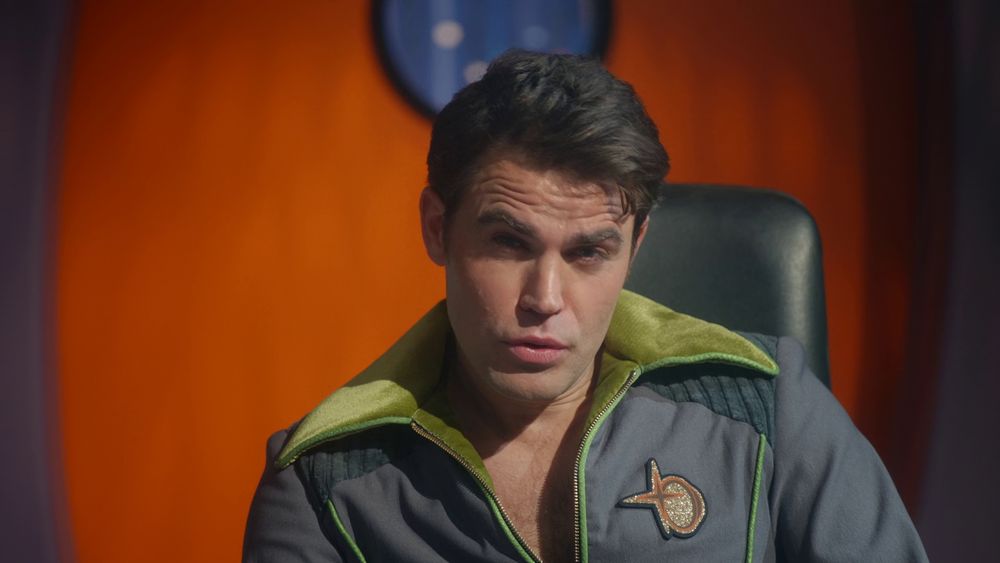 Maxwell Saint (as portrayed by the transporter buffer version of SNW James Kirk) mugs into the camera. 