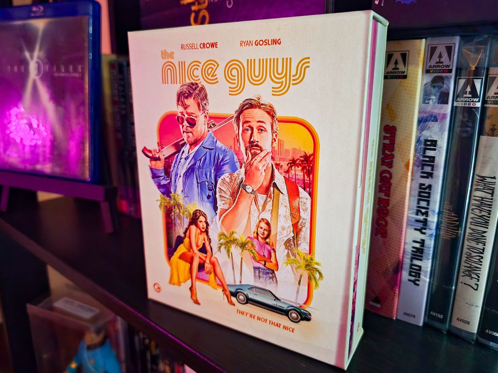The Second Sight 4K of The Nice Guys. It features a nice painterly image of the main cast in a retro style. It is in a hard case with a hardcover book inside as well as the discs. There's are some Arrow blu rays behind this box set. An X-Files blu-ray is off to the left. You can see a little bit of a Spock Mego in a plastic case. 