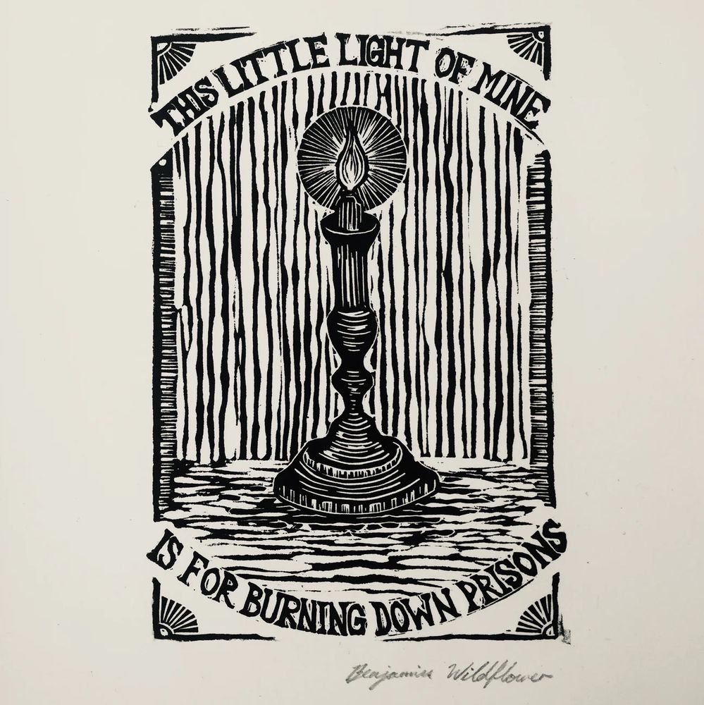 Print by Ben Wildflower. A lit candle is framed by the words “this little light of mine / is for burning down prisons””