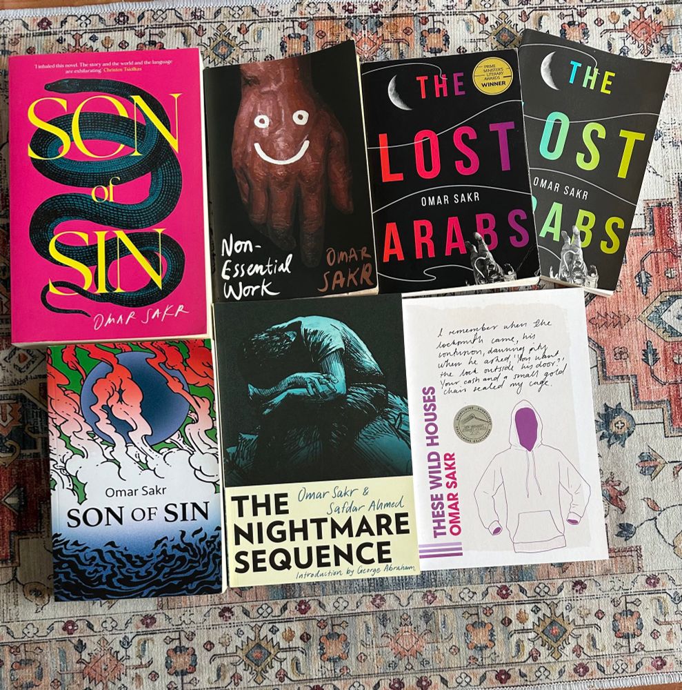 Photo of all of my books: These Wild Houses, The Lost Arabs, Non-Essential Work, Son of Sin, and The Nightmare Sequence. 

Includes the UK cover for Son of Sin (87press) and the US cover of The Lost Arabs (Andrew McMillan)
