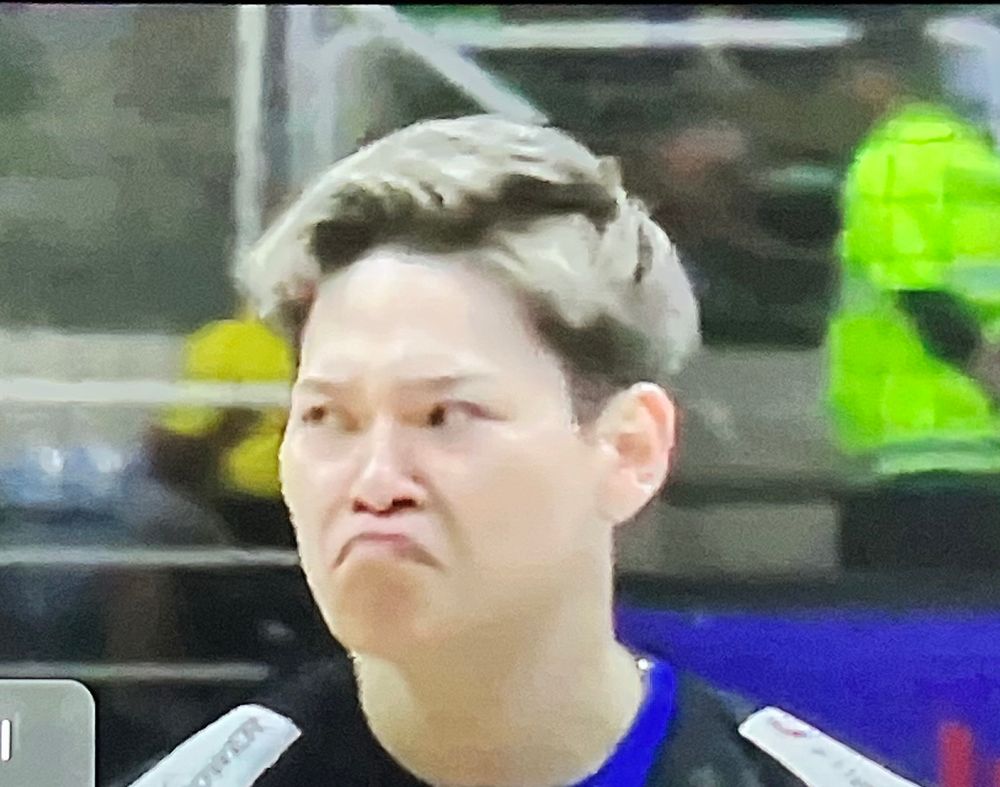 nishida making a super exaggerated frowny face 