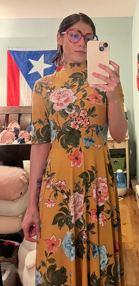 mirror selfie of nicky in a yellow floral dress