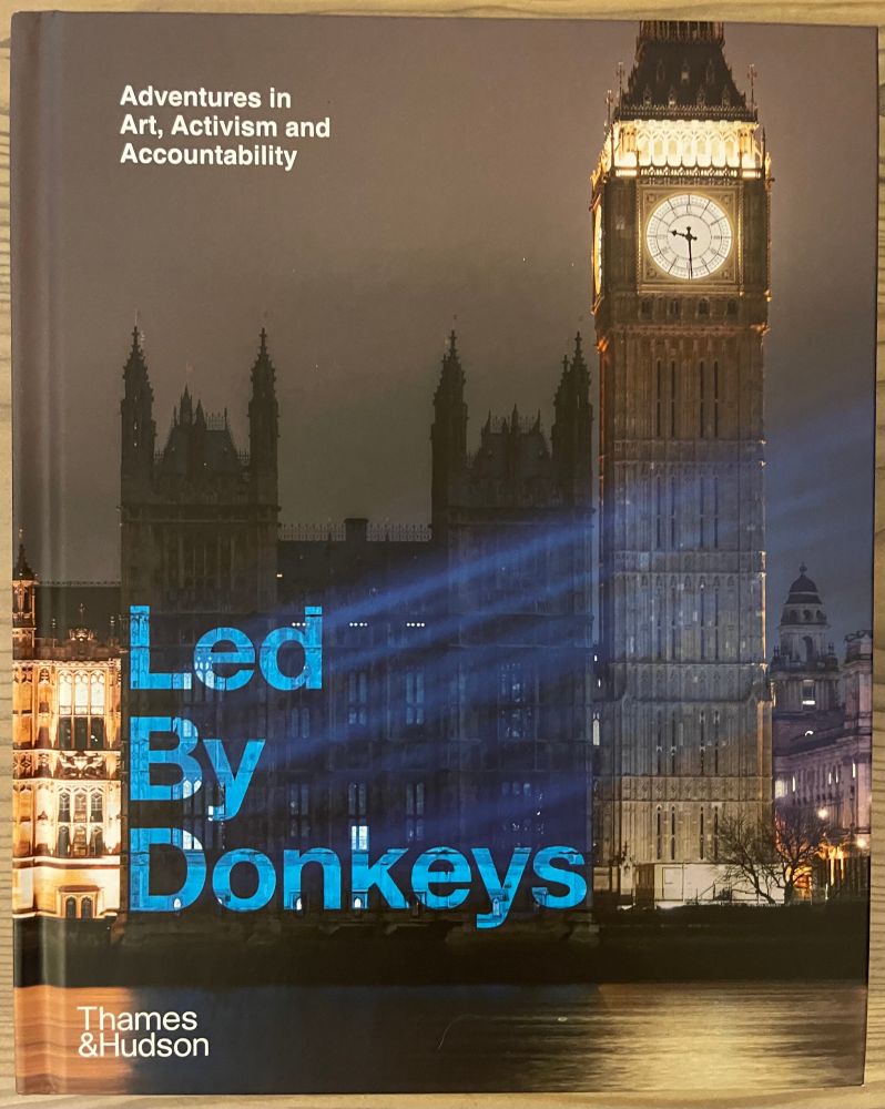 Led By Donkeys book cover showing name projected onto the Palace of Westminster 