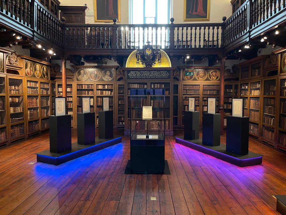Cosin’s Library. Exhibition plinths, wooden bookshelves and wooden floor.