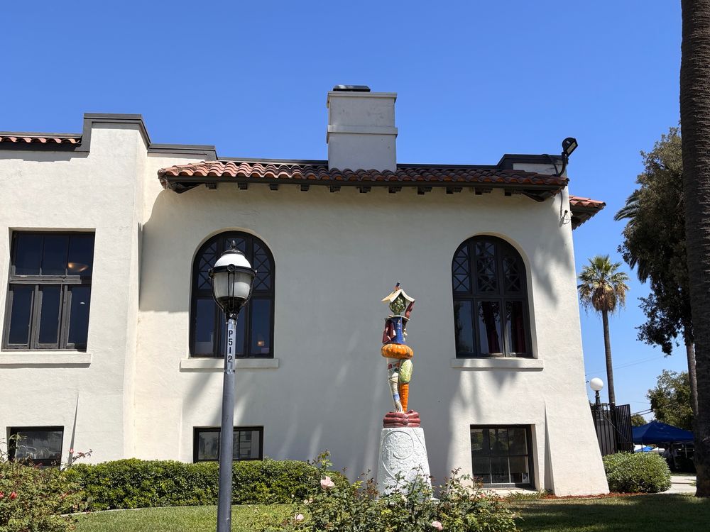 Side view of Woodland Public including a random statue. 