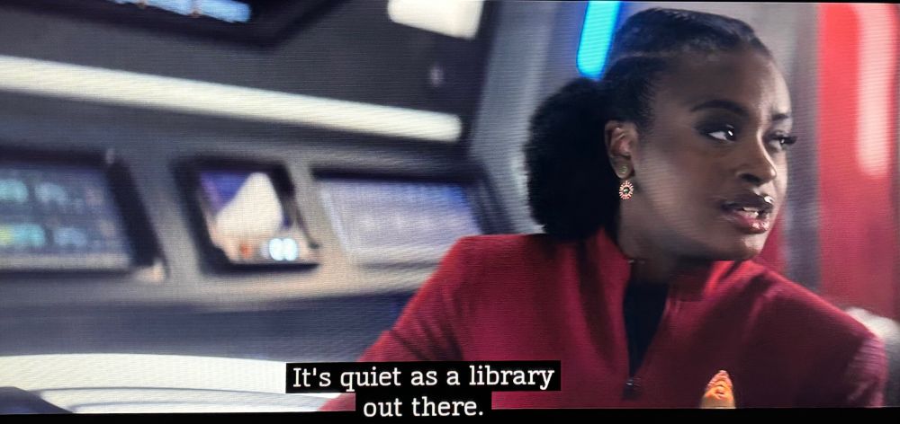 Uhura letting Number One know it's all silent across coms channels with a groan-worthy comparison to the noise level in a library. 