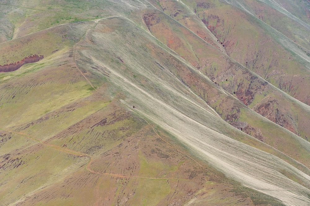 Gentle eroded slopes of the hills of the western side of Yakima Canyon viewed from the Baldy Mountain trail in the Wenas Wildlife Area.