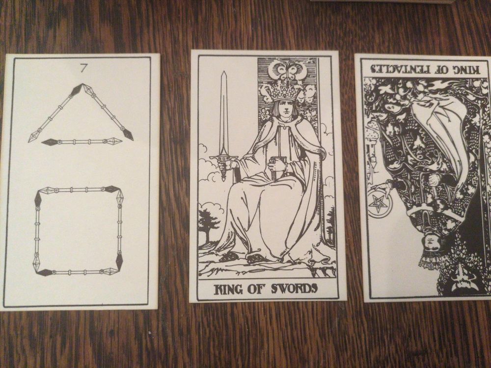 Seven of rods, king of swords, king of pentacles inverted