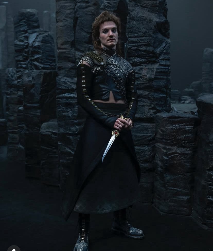 Mat dressed in the dark timeline, wearing goth attire.
