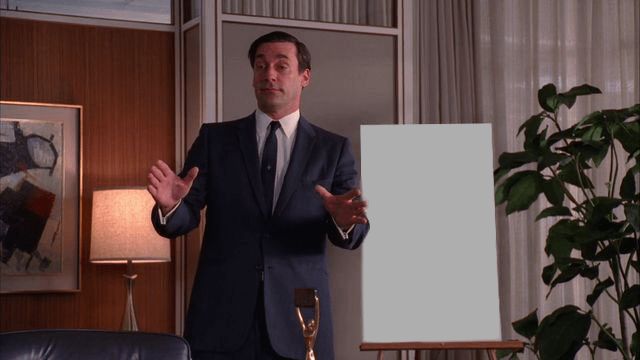 Don Draper from Mad Men, pitching a new idea, visibly drunk.