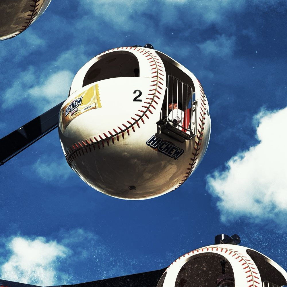 Baseball shaped Ferris wheel number two with a blue sky background