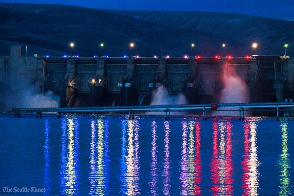 Lights illuminate the water at dusk at Little Goose Lock and Dam, one of the four Lower Snake River dams.⁠ Photo: Erika Schultz/The Seattle Times.
