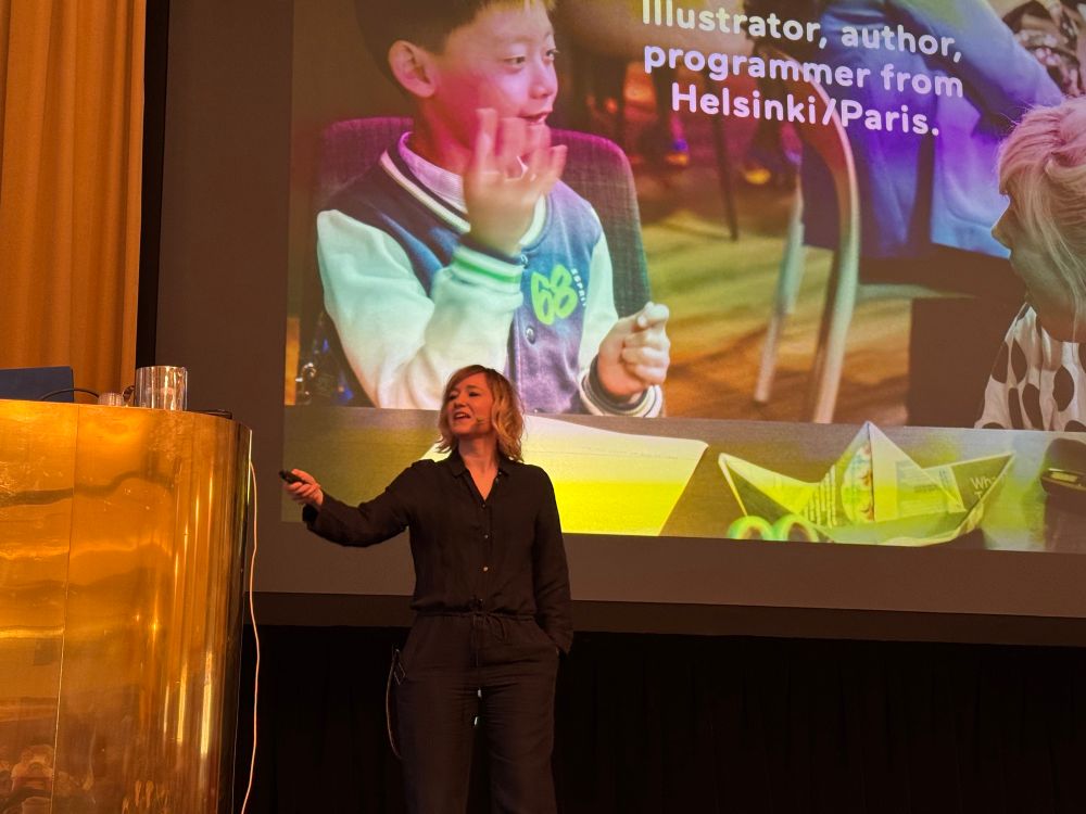 Linda on stage introducing her talk