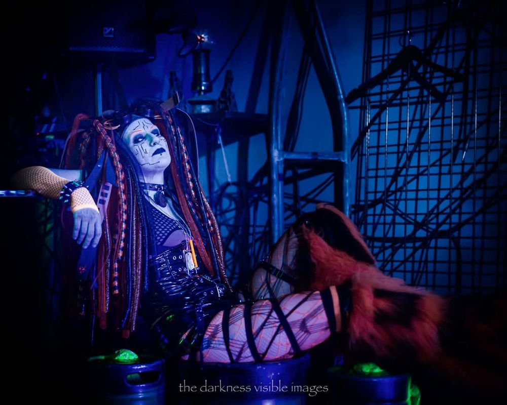 Cybergoth girl, in orange Cybergoth attire