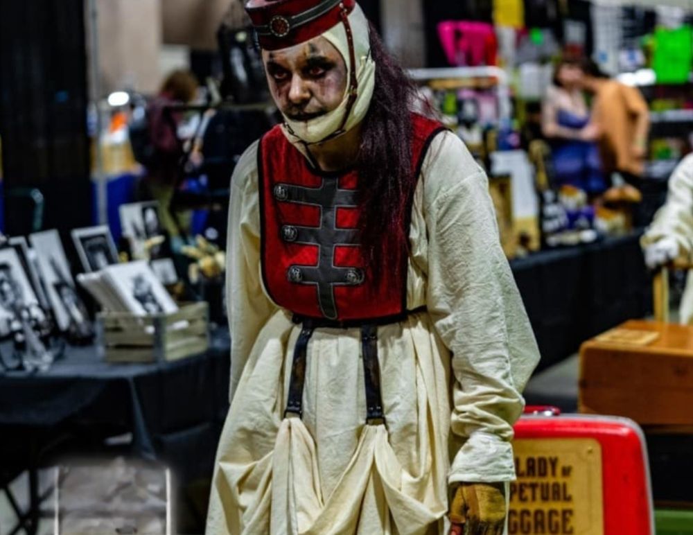 Man in period clothes with face painted