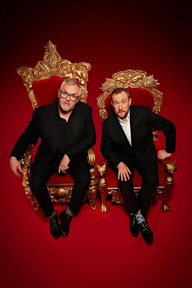 Promo photo for the series Taskmaster. Greg Davies and Alex Horne are seated in two golden thrones.