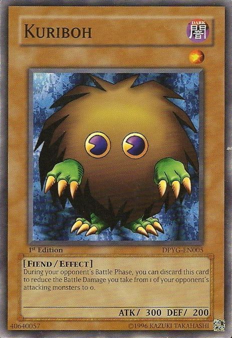 A Kuriboh yugioh card. Kuriboh is a brown ball of fur with green reptile like hands and feet, and pac-man style yellow and black eyes.