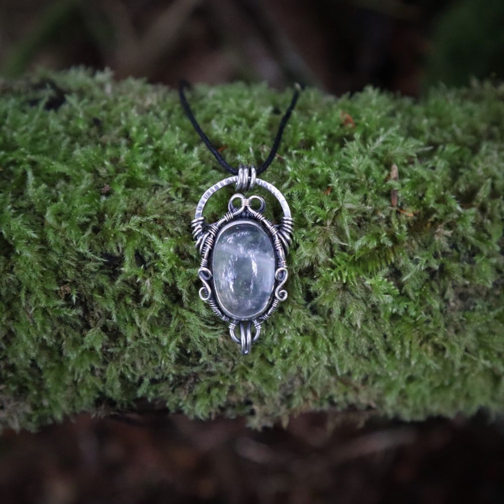 clear quartz crystal dark sterling silver wire wrapped pendant