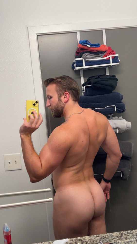 Mirror selfie of a man from behind
