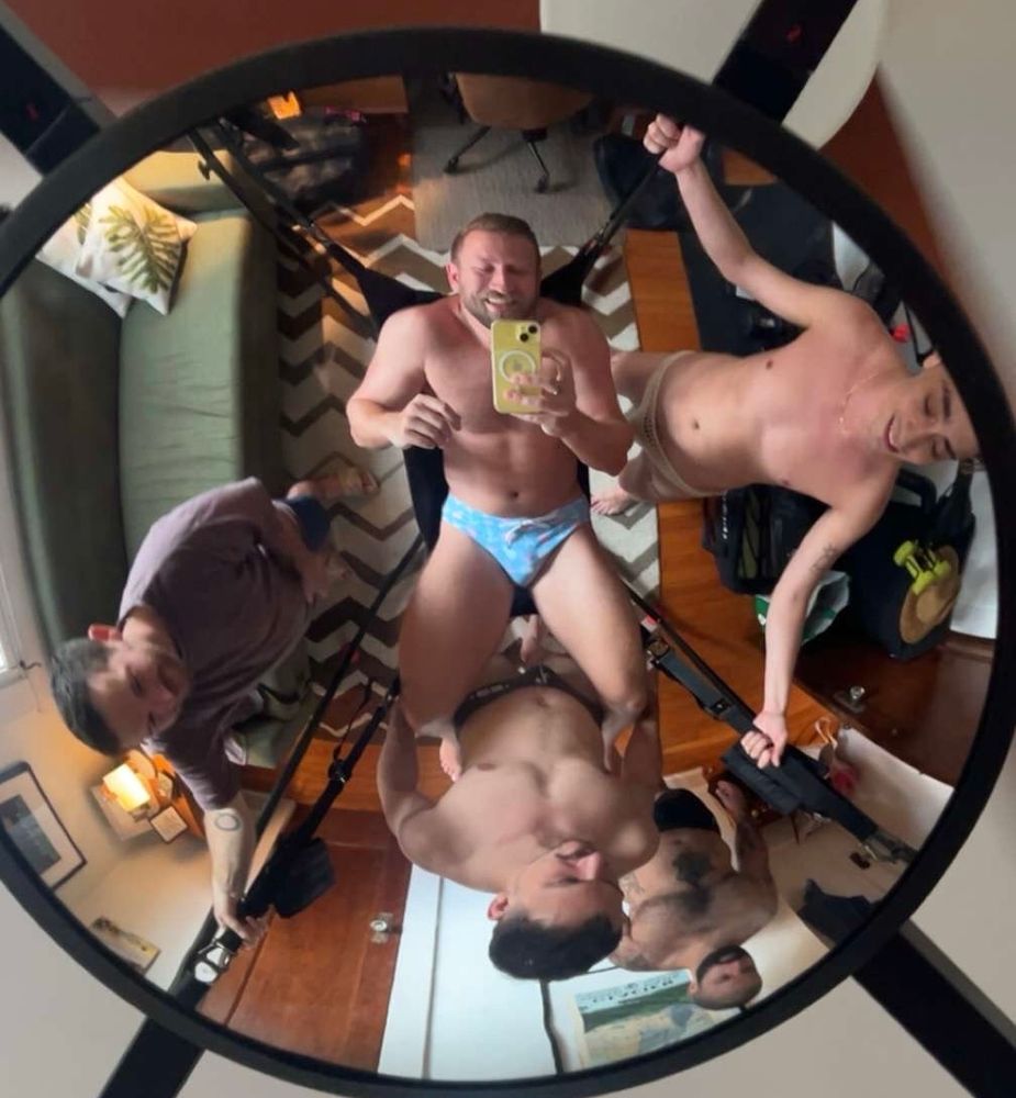 Picture of me in a sling surrounded by other gays. Everyone is clothed this was just a fun little pic