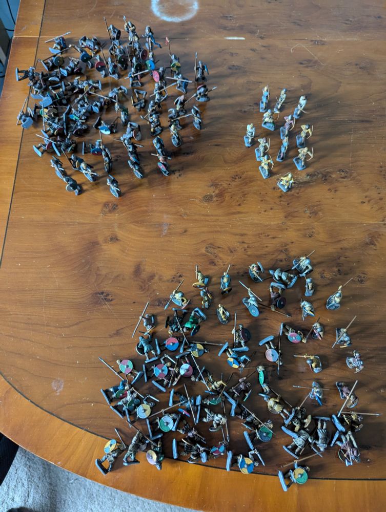 Approximately 120 painted Anglo Saxon wargames figures on a table.