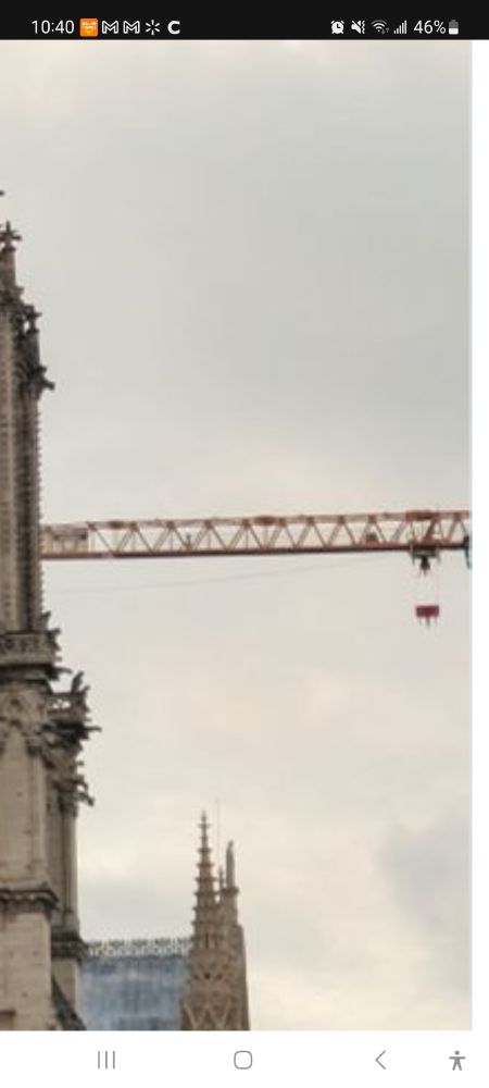 Zoom in on the crane in the background of the photo.