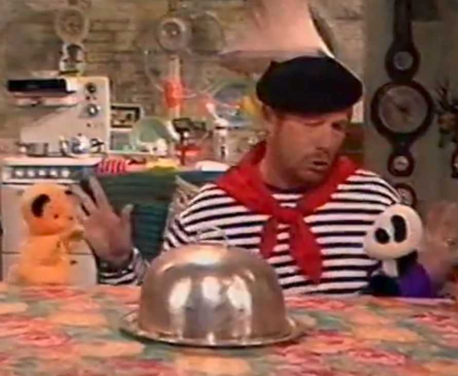 The Sooty Show, Soo the panda talking to Sooty the yellow bear. Matthew Corbett is dressed in French stereotypical striped sweater, red neckerchief and black beret, with a riiiiiiiiidiculous French accent