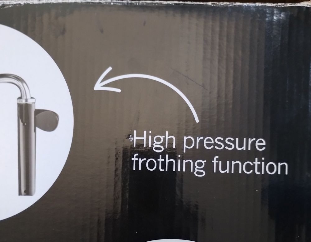 Box of an espresso/cappuccino machine with sign pointing to outlet labelled "High pressure frothing function"