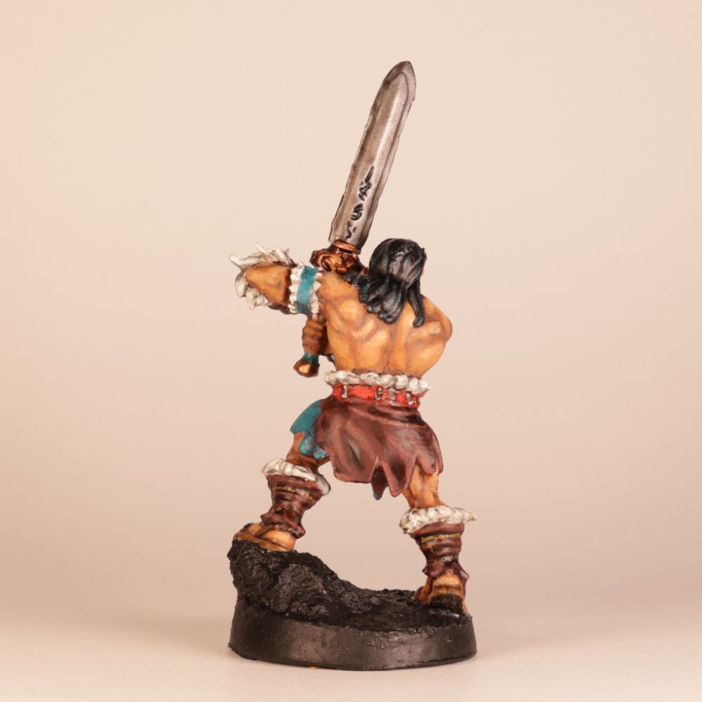 Painted miniature Barbarian from Heroquest game (back view).