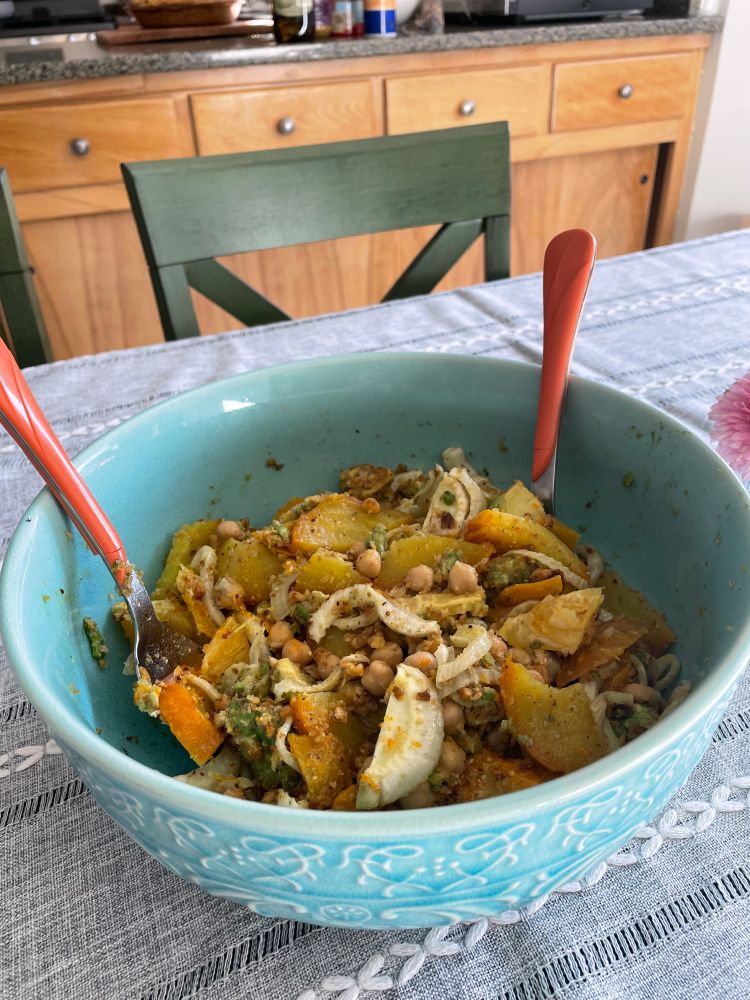 A salad of yellow beets, fennel, chickpeas, and avocado. 