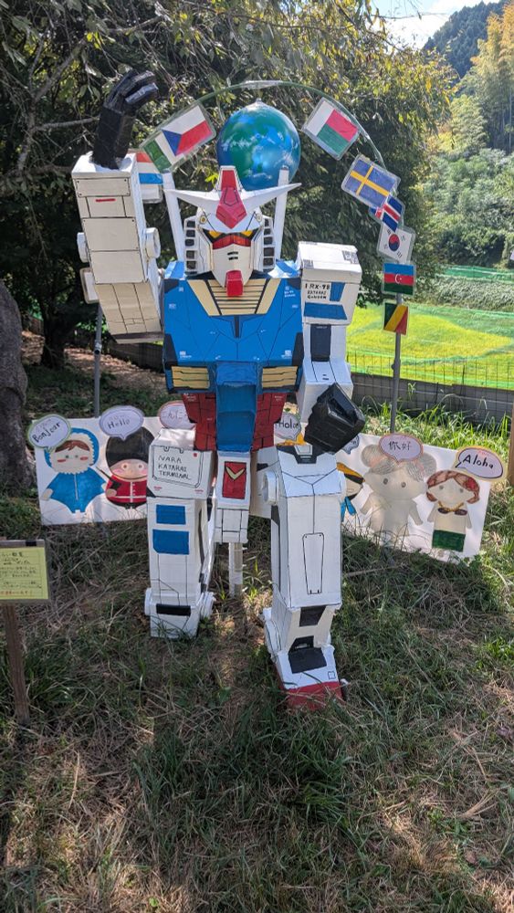A cardboard Gundam scarecrow 