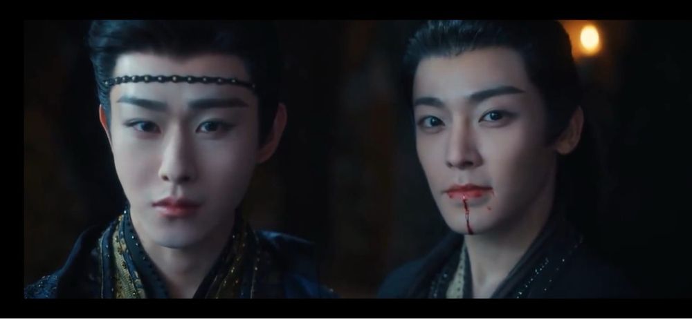 Pretty boy demon hunter next to luscious big bad demon, looking us straight in the eyes as we melt into goo