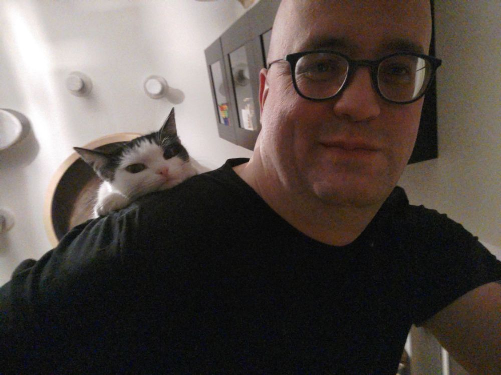 A selfie, with a black and white cat Bella looking over my shoulder cutely.
