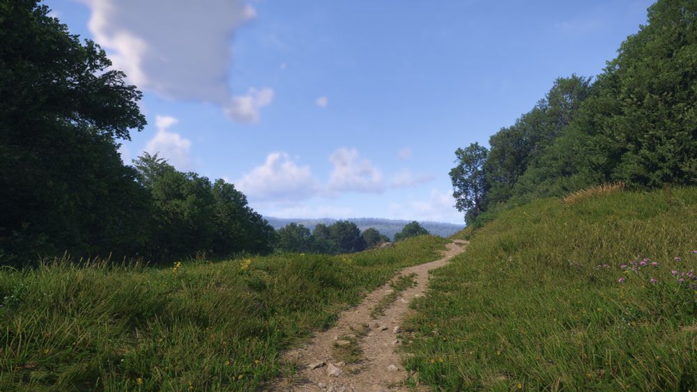 Capture d'écran du jeu Kingdom Come Deliverance 2 montant un paysage.