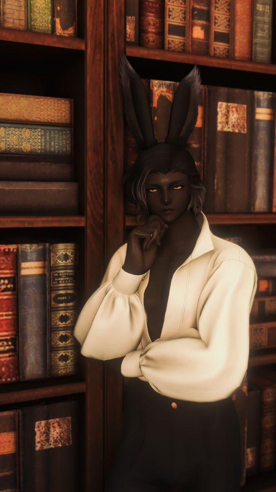 Erenville standing in front of a bookshelf with one hand on his chin,wearing a flowy white shirt and tight pants, im so normal. 
