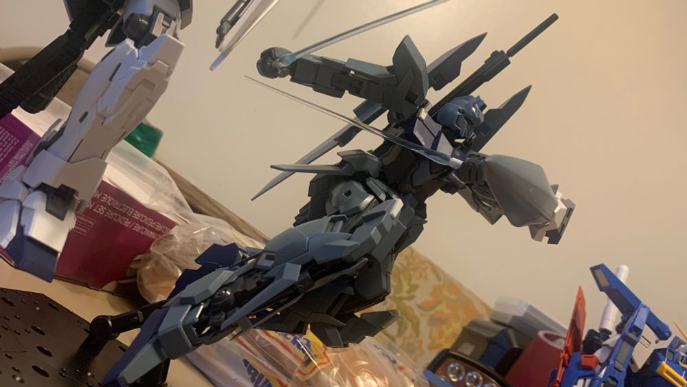 Master Grade Delta Plus with dual beam sabers drawn on an action base