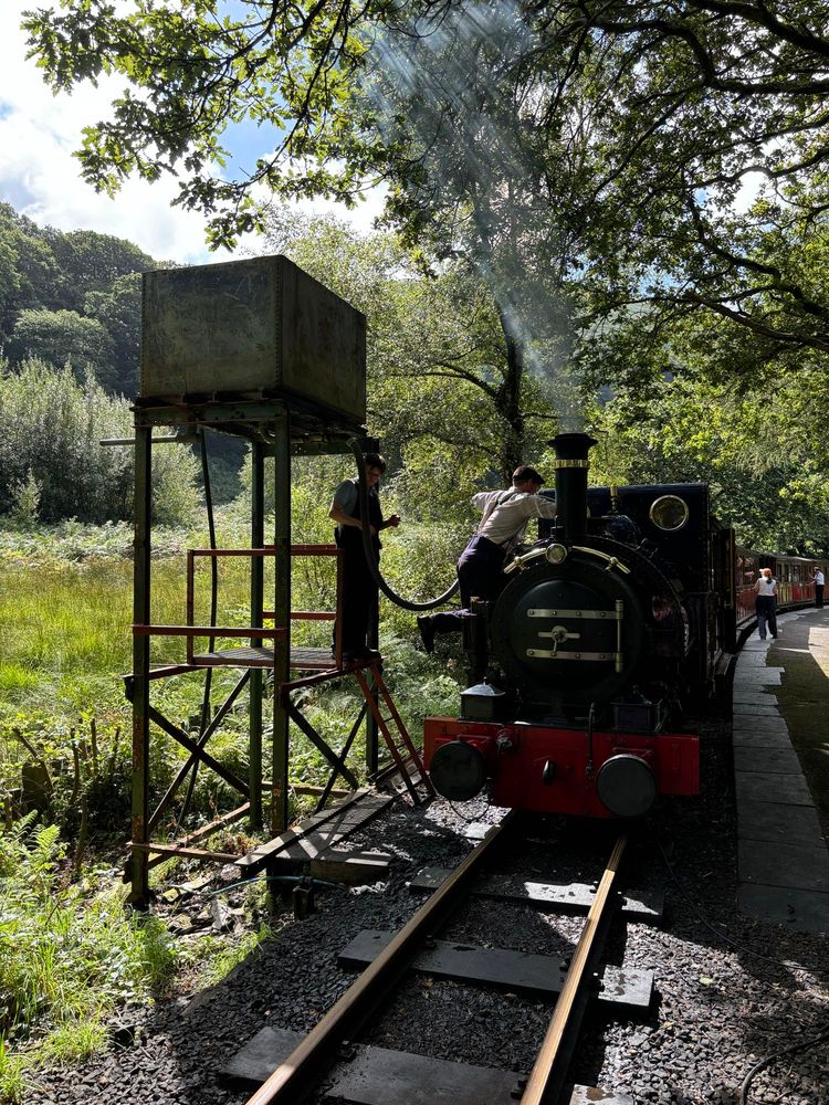 Talyllyn taking on water. Very, very lucky to have not only ridden behind her, but to have joined the crew on the footplate for a spell. A remarkable engine!