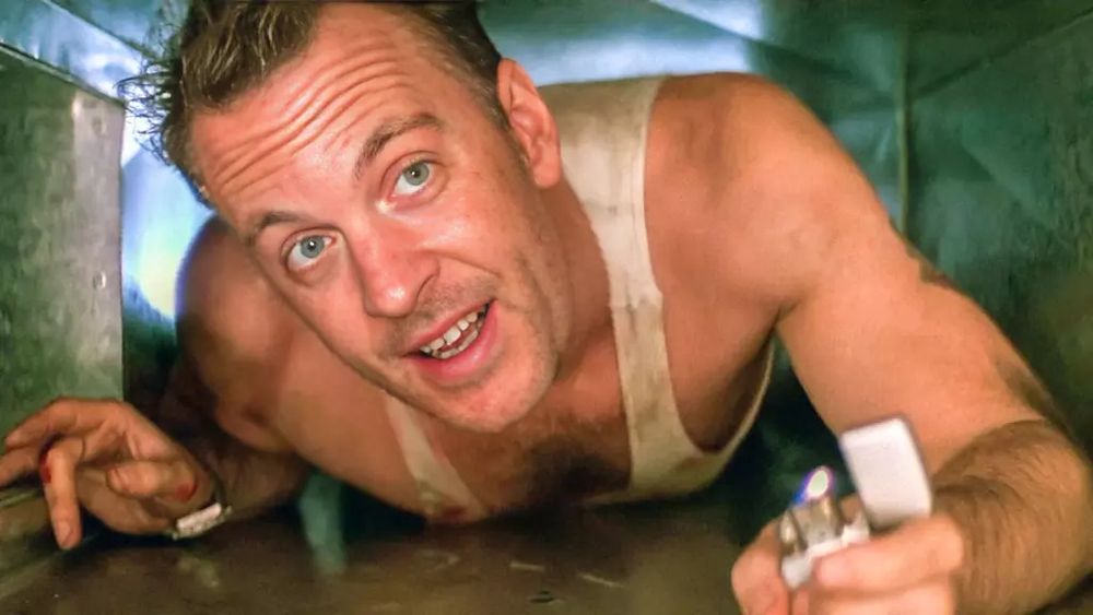 A still from the movie Die Hard with Bruce Willis in the air ducts, but with my face instead of Bruce Willis