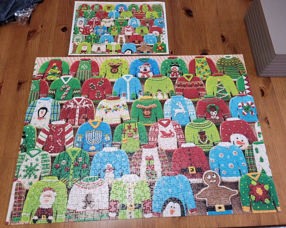 1000 piece jigsaw puzzle of 40 Christmas sweater cookies and one nervous looking gingerbread man.