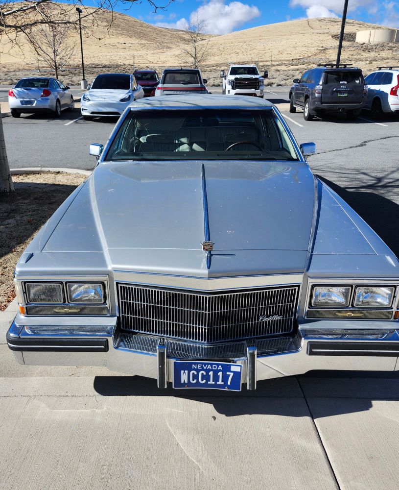 1984 Cadillac Sedan de Ville, in silver, front grille