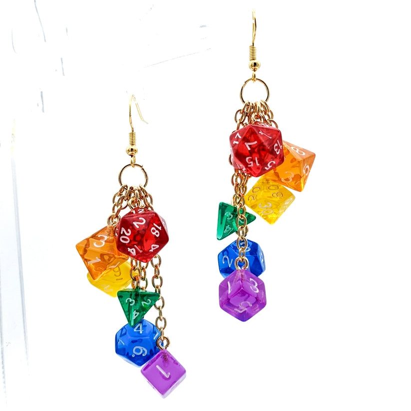 Dice earrings with gold findings and 6 miniature polyhedral dice in the colors of the rainbow gay pride flag hanging from separate gold chains