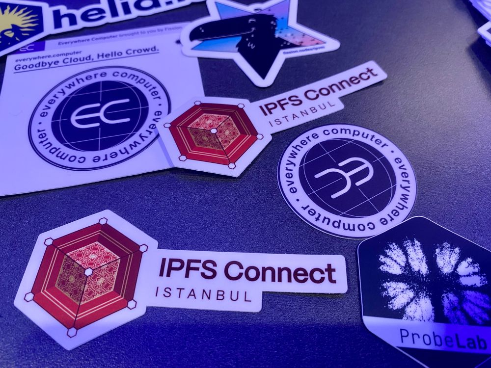 pile of stickers at IPFS Connect