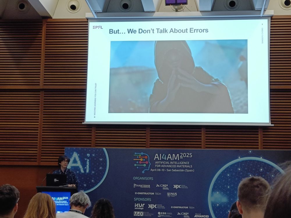 Sanggyu in front of one of his slide, reading 'But... We Don't Talk About Errors'