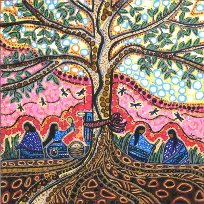 Colourful scene of women working on the land. In the centre of the painting, a big tree with roots deep in the earth reaches out to the sky, sheltering the women. An infant in a cradleboard is secured to the tree as the mother works. Dragonflies are flying around.