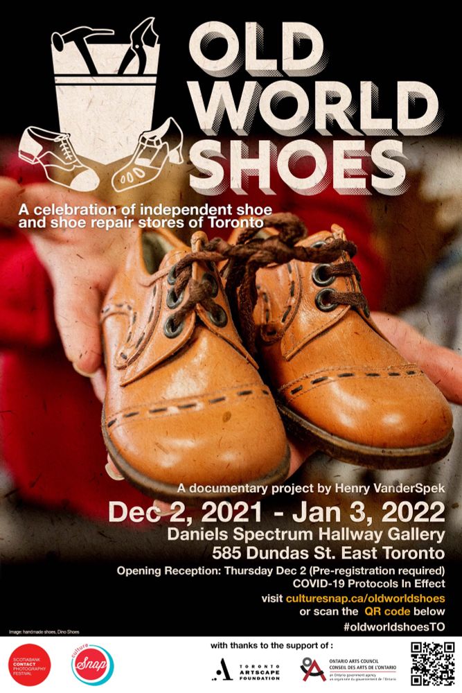 A poster for an exhibit titled “Old World Shoes”. On the poster is a photo of hands holding out a pair of light brown handmade children’s shoes. 