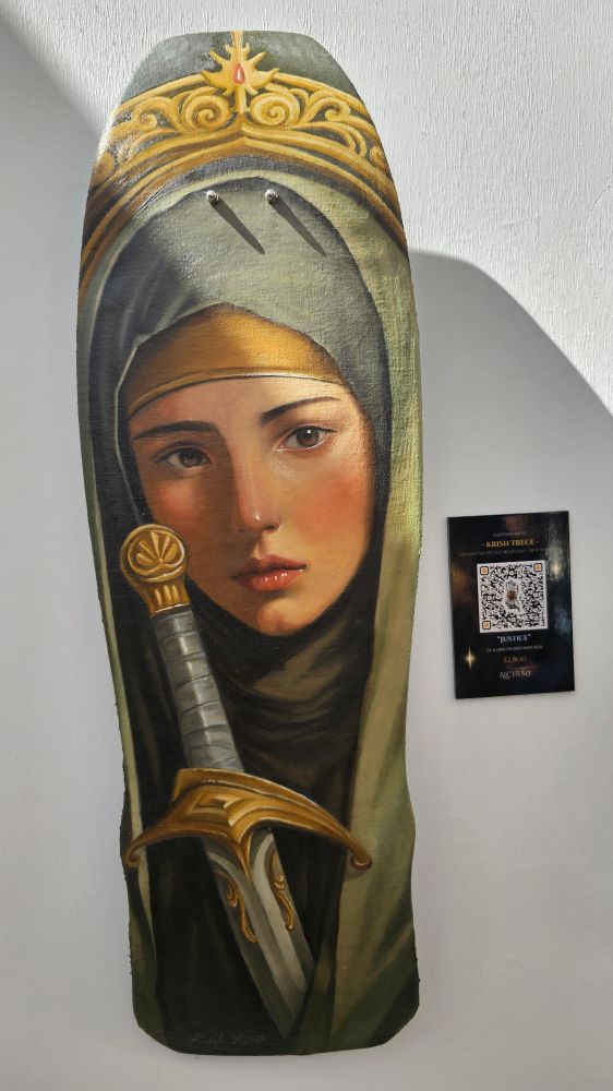 A tattoo artist's painting on a skateboard. 