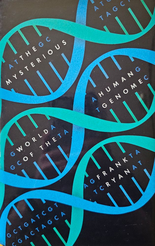 Photo of the cover of the book "The Mysterious World of the Human Genome" by Frank Ryan.
