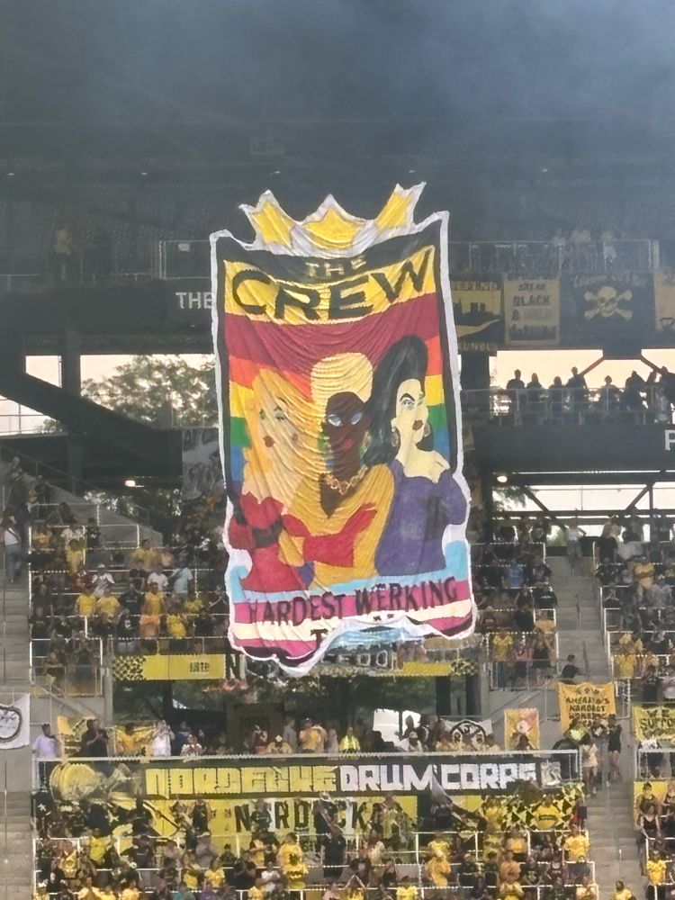 Nordecke sign tonight featuring trans flag. “THE CREW: HARDEST WERKING TEAM”