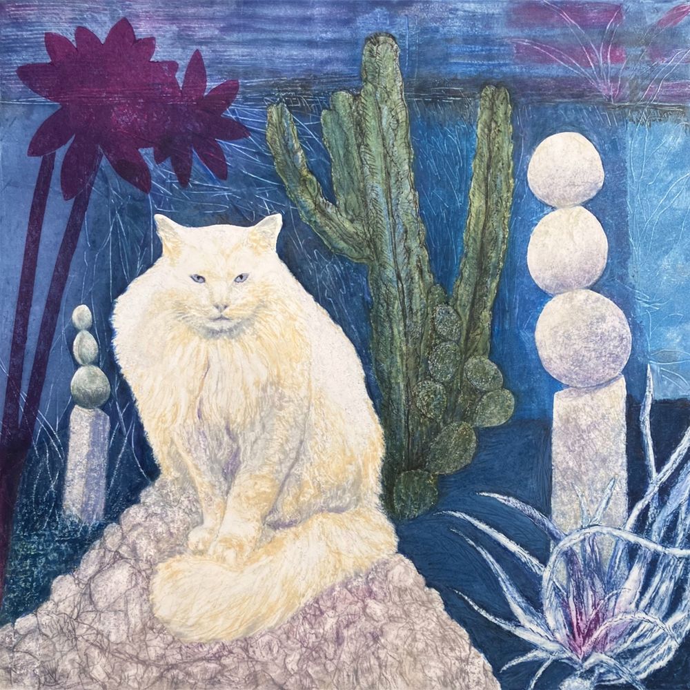 A fluffy white cat with light blue eyes is staring directly at you. She is seated on a large triangular rock in front of two sculptures, each with three large round rocks balanced like cairns on stone pedestals. One sculpture is on the right, with a spiky leaved agave in front of it. The other smaller sculpture is behind on the left. A tall wavy edged cactus and a prickly pear cactus are behind the cat. A large tall stemmed magenta flower sculpture shape is on the left. The background is shades of blue and turquoise with magenta highlights. Original monotype by Anita Heckman, 12” x 12” Akua ink on Arnhem heavy paper, 2025. Available for purchase: www.anitaheckman.com