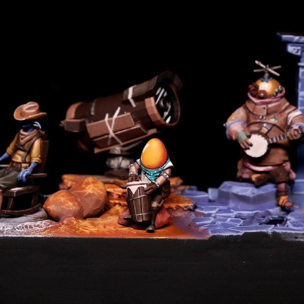 A close up of a diorama of the Outer Wilds, showing a character in a space suit playing a drum
